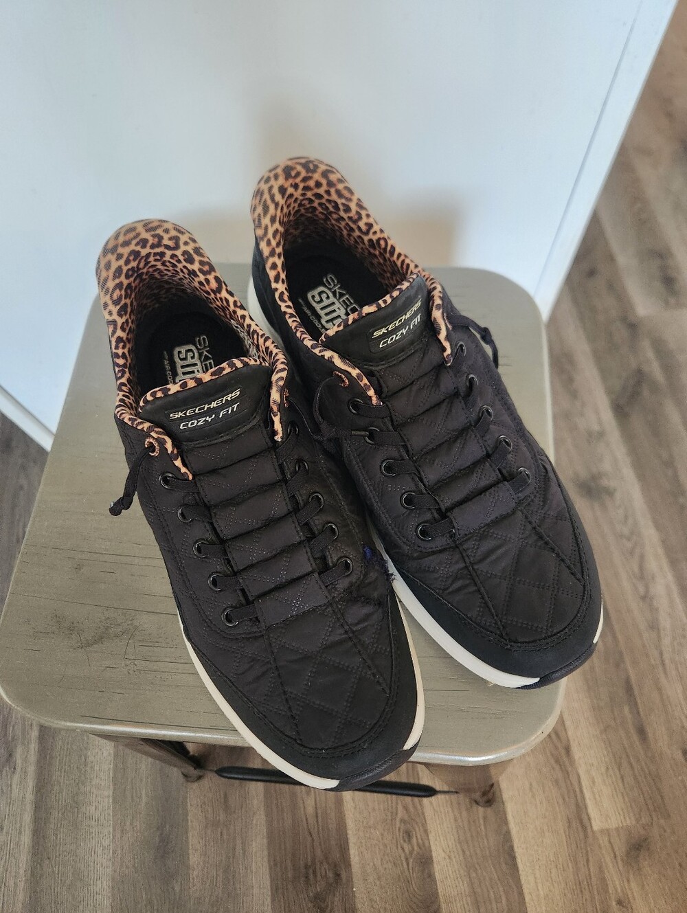 Skechers Black slip On Quilted Sneakers with Leopard Print Lining